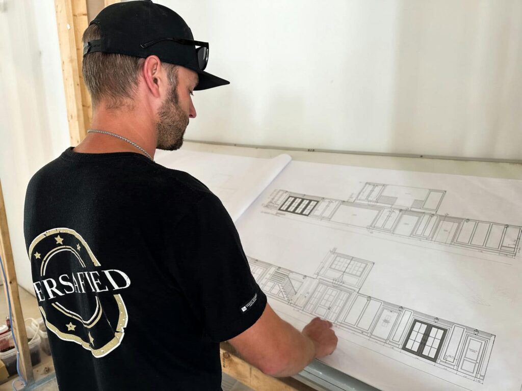 versa homes builder looking at floor plans