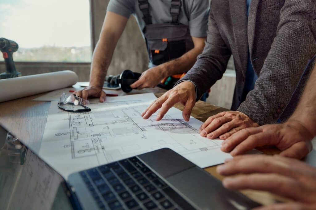 team evaluating custom home site plan