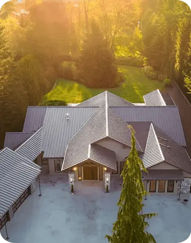 Aerial view of a custom design-build home in Langley at golden hour