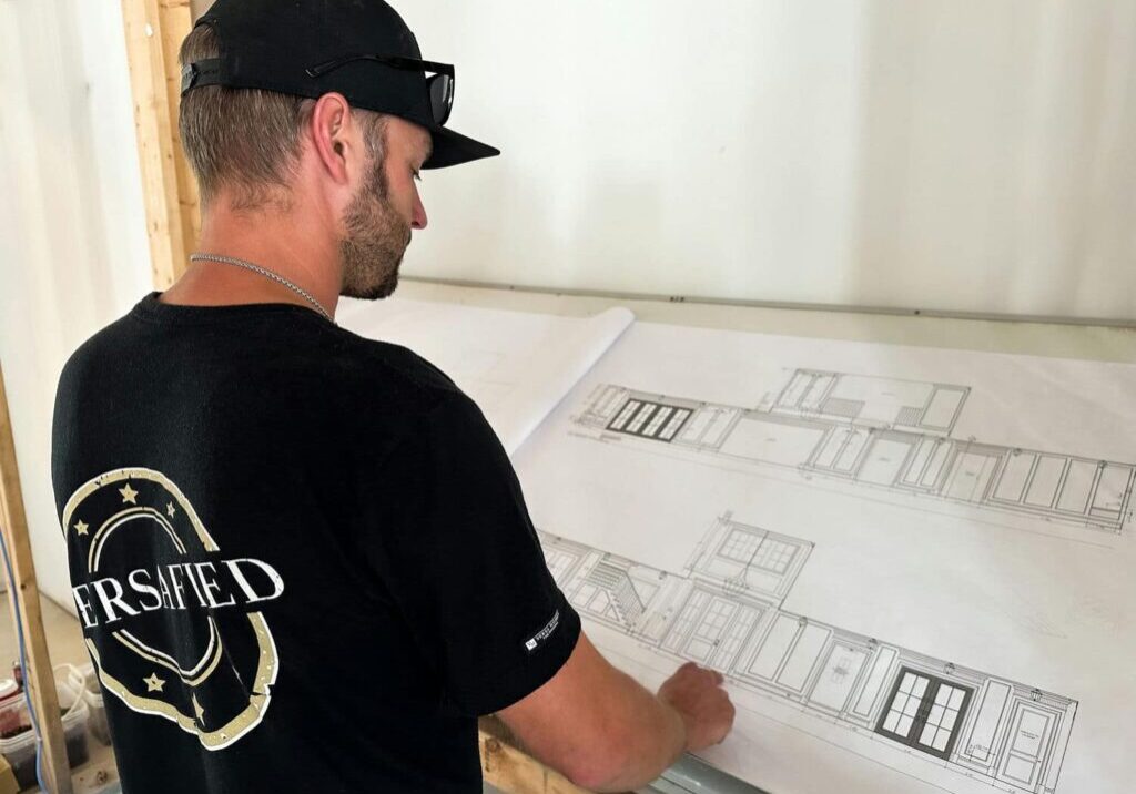 versa homes builder looking at floor plans